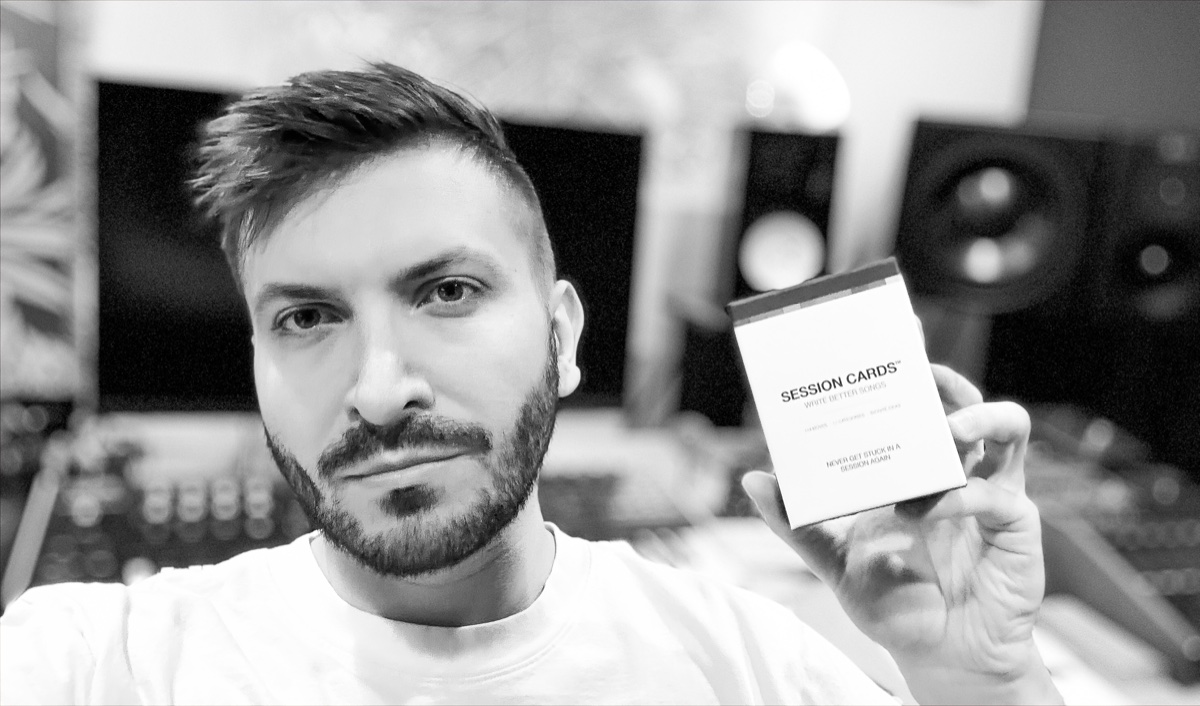 Tommy Rush holding Session Cards in the studio